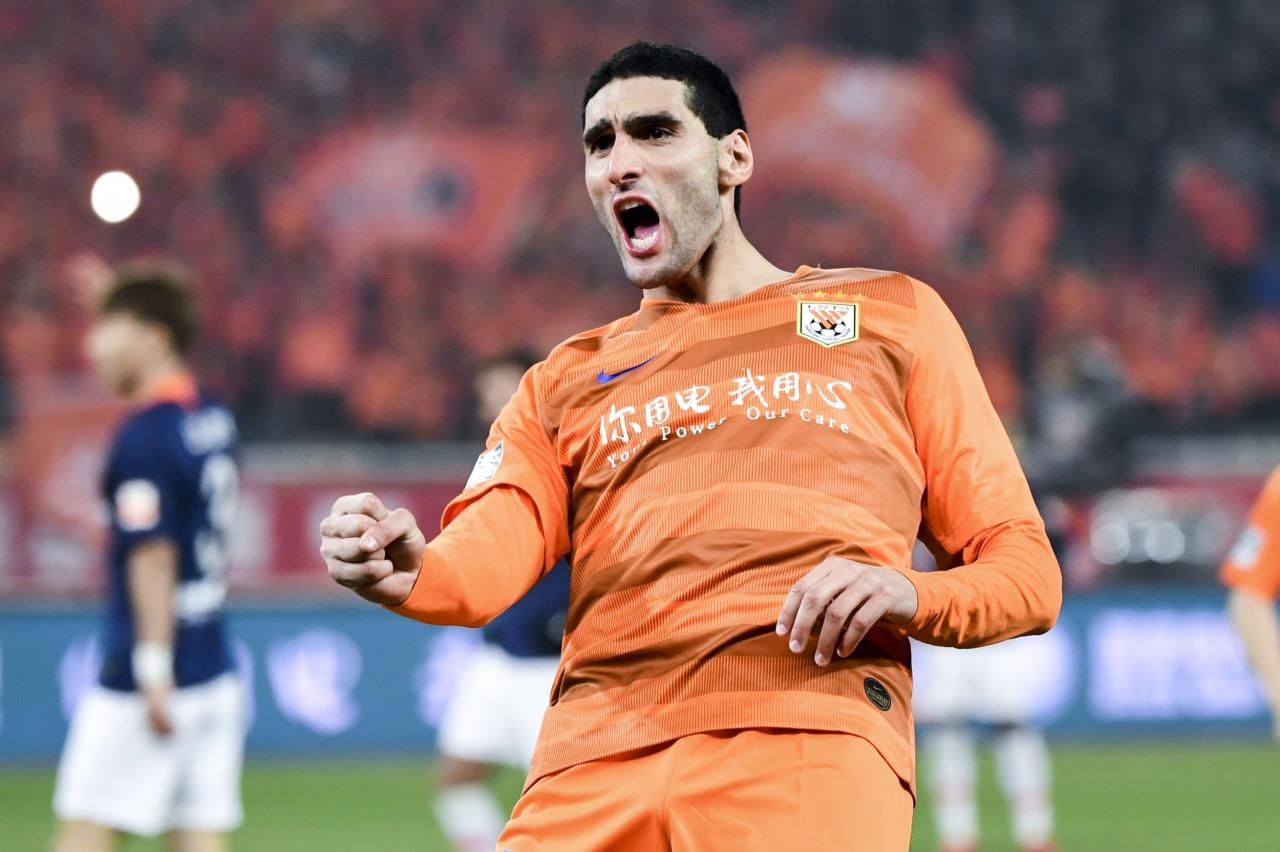 JINAN, CHINA - MARCH 01: #25 Marouane Fellaini of Shandong Luneng celebrates a goal during the 2019 Chinese Super League match between Shandong Luneng and Beijing Renhe at Luneng Stadium on March 1, 2019 in Jinan, China. (Photo by DI YIN/Getty Images)