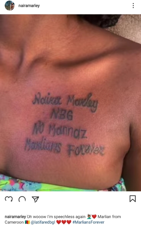 Singer Naira Marley Left Speechless As Female Fan Tattoos His Name On Her Chest