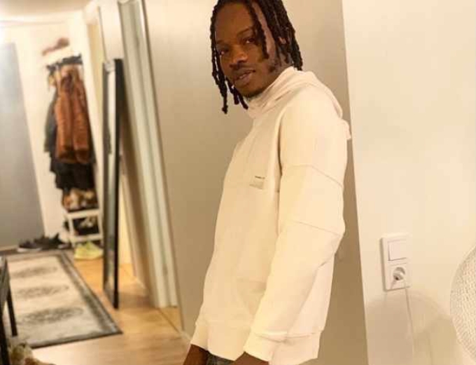 Nigerians Drag Lady For Getting Tattoo Of Naira Marley On Her Lap