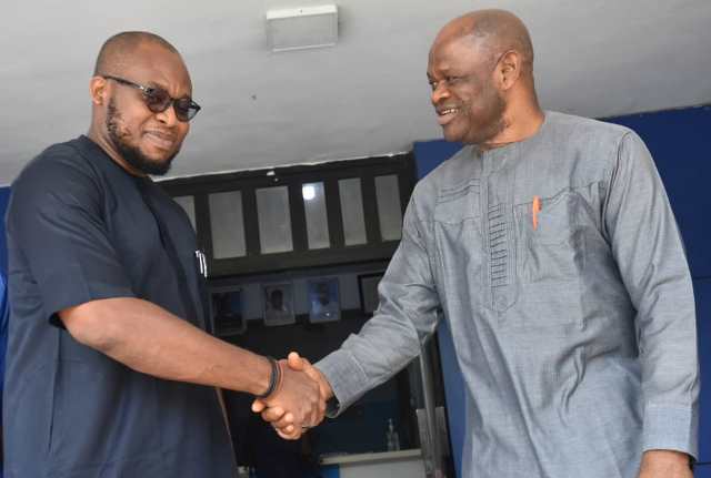 Mr Chijioke Uzoho, Commercial Manager, GACN and Mr Silas Nwoha in a handshake during the GACN visit to NAN headquarters, Abuja on Thursday